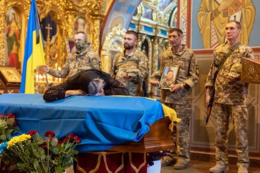 KYIV, UKRAINE - Aug. 25, 2022: Funerals of the Ukrainian soldier Yuriy Karakai who died from mortar fire in the battle in Kherson region