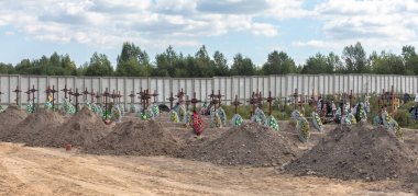 BUCHA, UKRAINE - Sep. 02, 2022: Burial of the remains of 13 unidentified and two identified people who were killed in the Bucha district during the Russian occupation