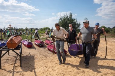 BUCHA, UKRAINE - Sep. 02, 2022: Burial of the remains of 13 unidentified and two identified people who were killed in the Bucha district during the Russian occupation