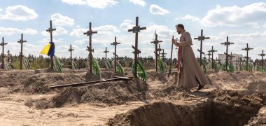 BUCHA, UKRAINE - Sep. 02, 2022: Burial of the remains of 13 unidentified and two identified people who were killed in the Bucha district during the Russian occupation