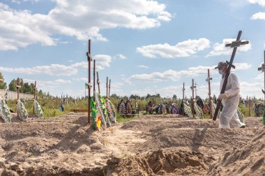 BUCHA, UKRAINE - Sep. 02, 2022: Burial of the remains of 13 unidentified and two identified people who were killed in the Bucha district during the Russian occupation