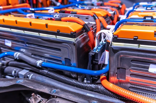Electric car battery with power connections closeup. Blue toned. EV car battery at maintenance
