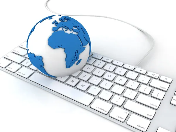 Globe on a keyboard laptop — Stock Photo, Image