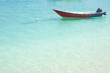 Blue beach with boat