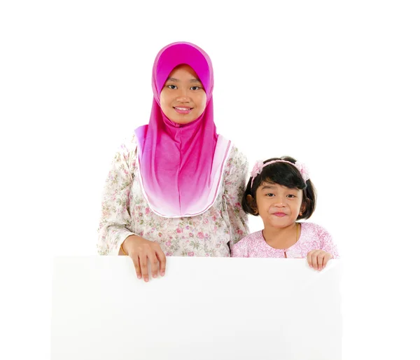 Malay sisters with board — Stock Photo, Image