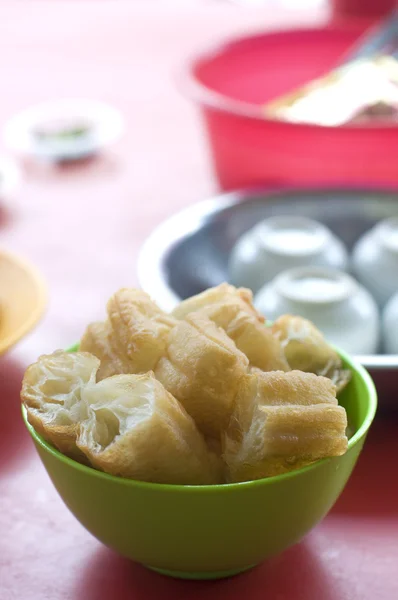 'Yau Char Kuai' (literally translated to 'Oil Fried Ghost'), a crispy fried flour Malaysian snack — Stock Photo, Image