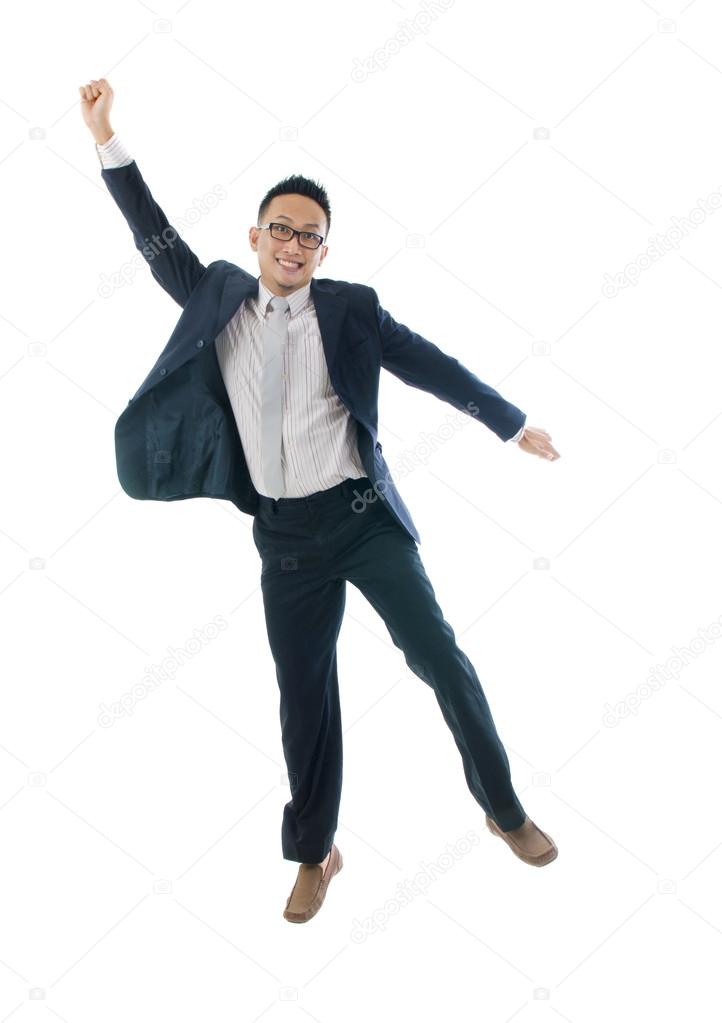 Asian man jumping in joy