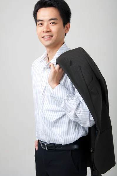 Asijské muž drží kabát — Stock fotografie