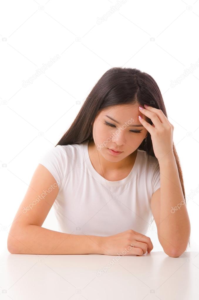 Asian girl having a depression, isolated on white