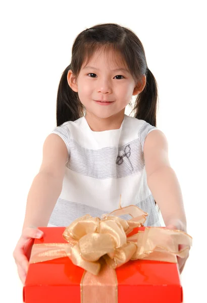 Little Asian girl arms out holding a beautiful wrapped present — Stock Photo, Image