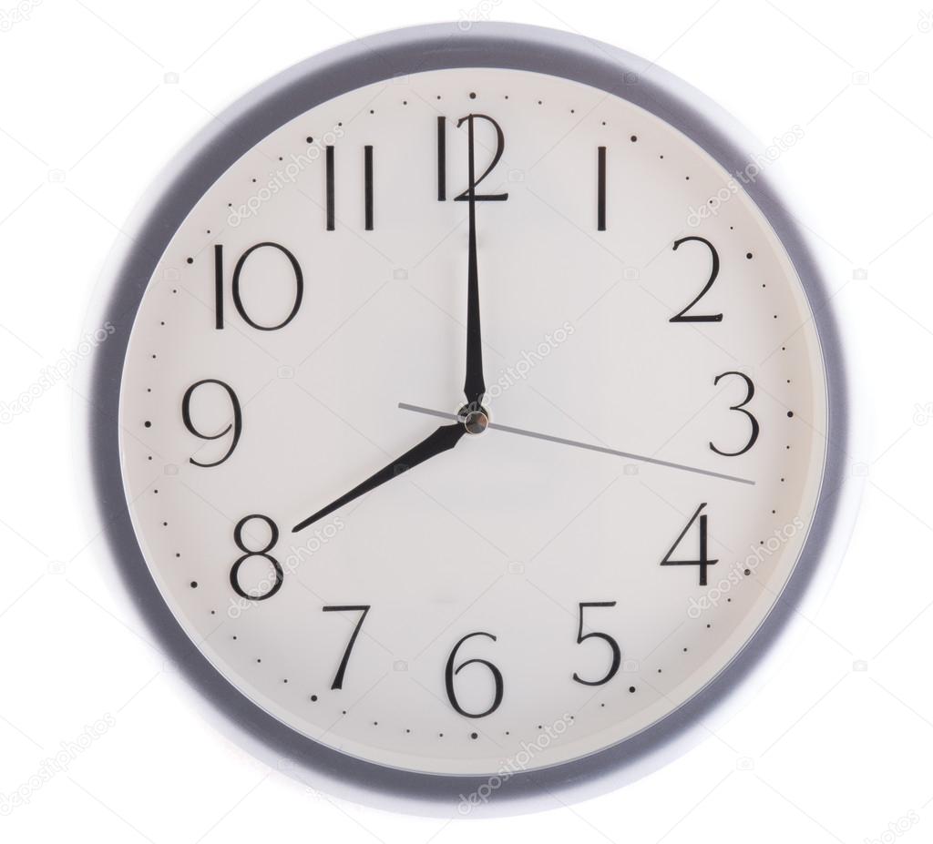 Isolated white clock at eight