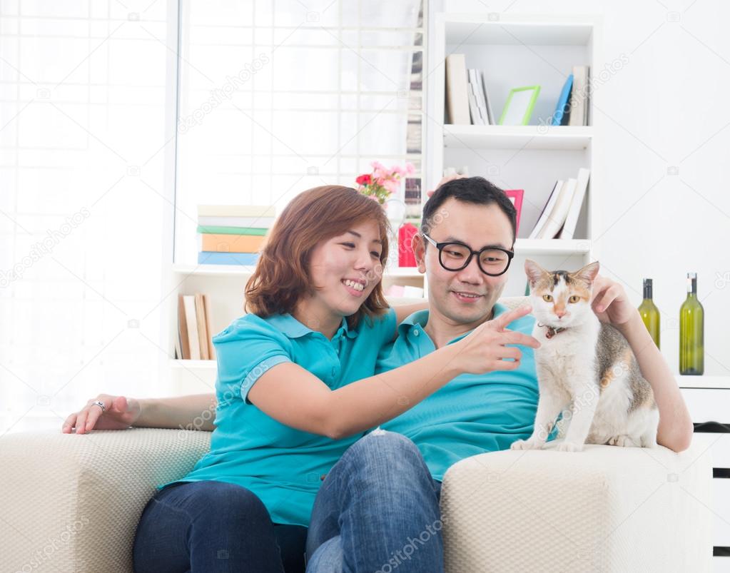 asian couple with cat