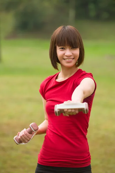 Asian girl dumbbell — Stock Photo, Image