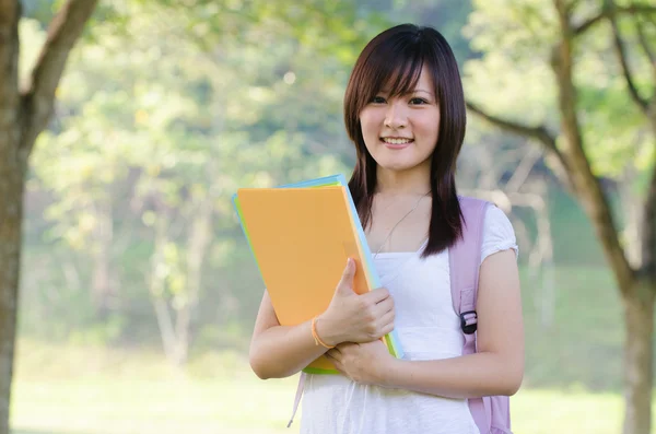 Asian college girl sitting — Stock Photo, Image