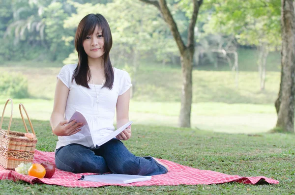 Asian college girl sitting — Stock Photo, Image