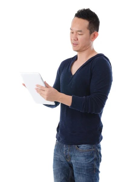 South east asian man with a tablet in casual Stock Photo