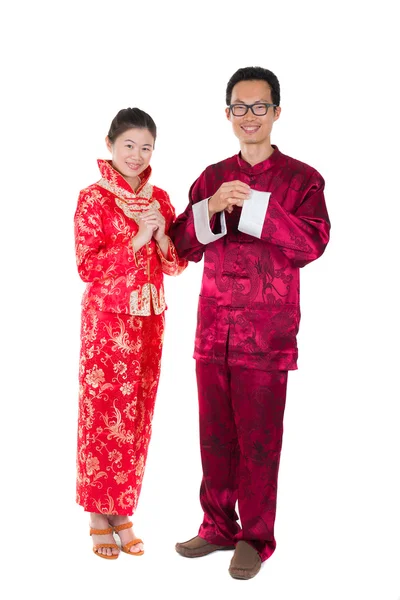 Asian couple celebrating chinese new year in traditional clothes — Stock Photo, Image