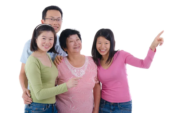Happy adult asian family pointing somewhere — Stock Photo, Image