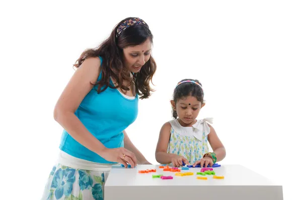 Happy looking indian mother and daughter learning with education — Stock Photo, Image