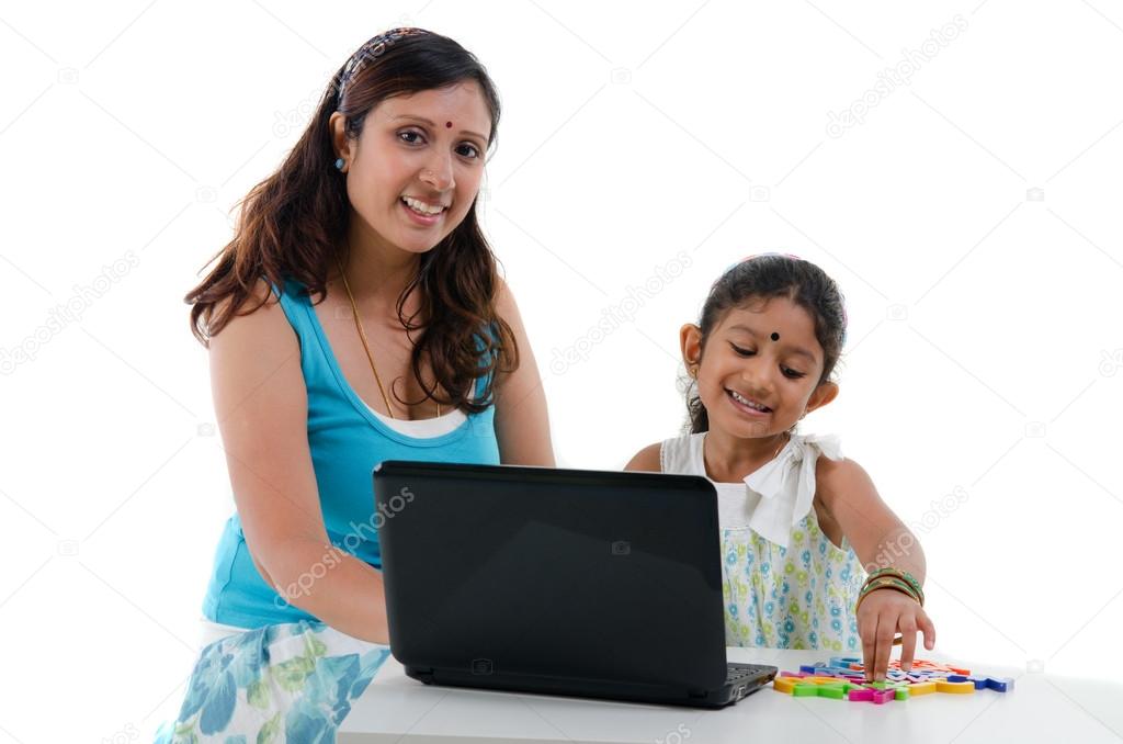happy looking indian mother and daughter