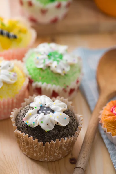 Beautiful cup cakes muffins with baking background — Stock Photo, Image