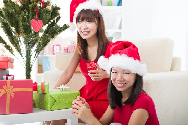 Chinese girl friends during a christmas celebration Royalty Free Stock Photos