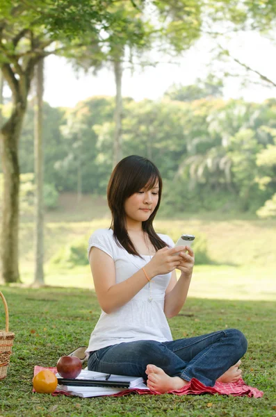 A portrait of a asian chinese race college student at campus on — Stock Photo, Image