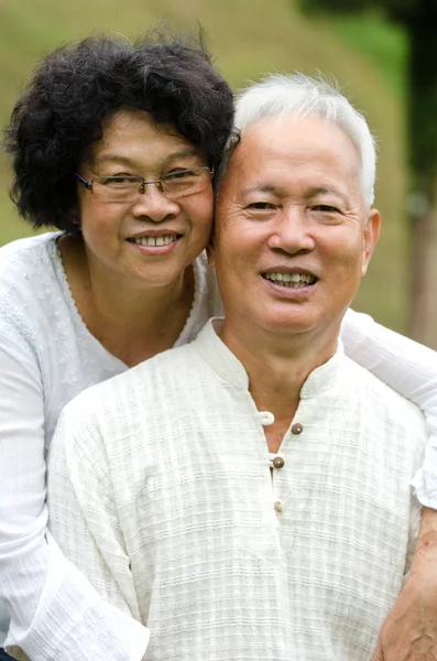 Happy asian senior couple embracing each other — Stock Photo, Image