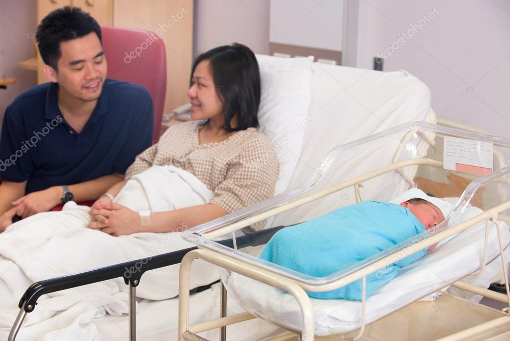 Asian newborn baby girl and daddy in hospital