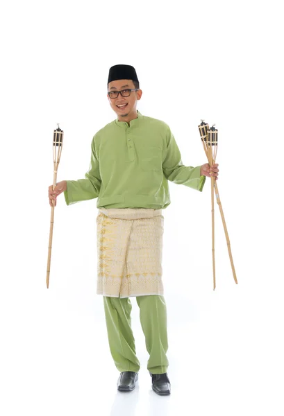 Malay male celebrating hari raya with oil lamp and isolated whit — Stock Photo, Image