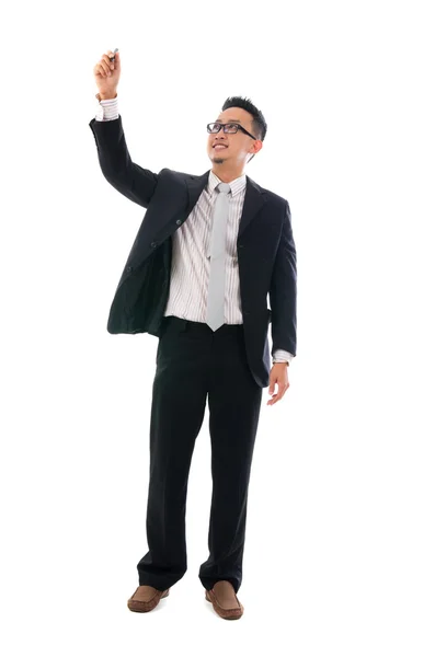 Male writing something on glass board with marker — Stock Photo, Image