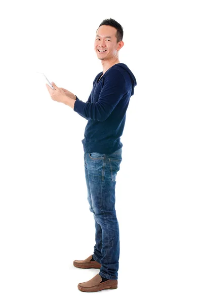 Fullbody Asian man using tablet computer standing over white bac — Stock Photo, Image