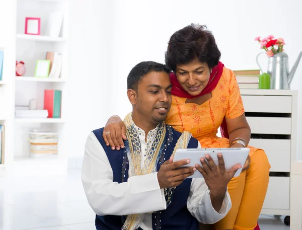 Indian mother and son enjoying surfing with tablet in the living — Stock Photo, Image