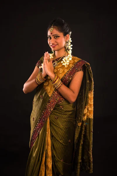 Traditional indian female greeting with dark background — Stock Photo, Image