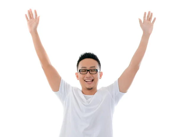 Casual asian man with hands raised eyes closed — Stock Photo, Image