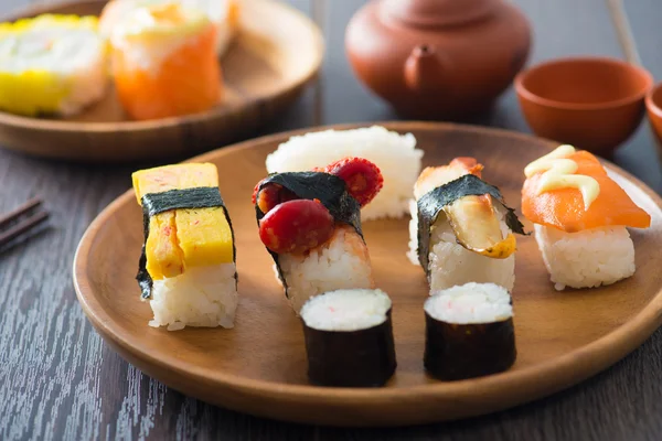 Sushi Assortment On wooden Dish, close up — Stock Photo, Image