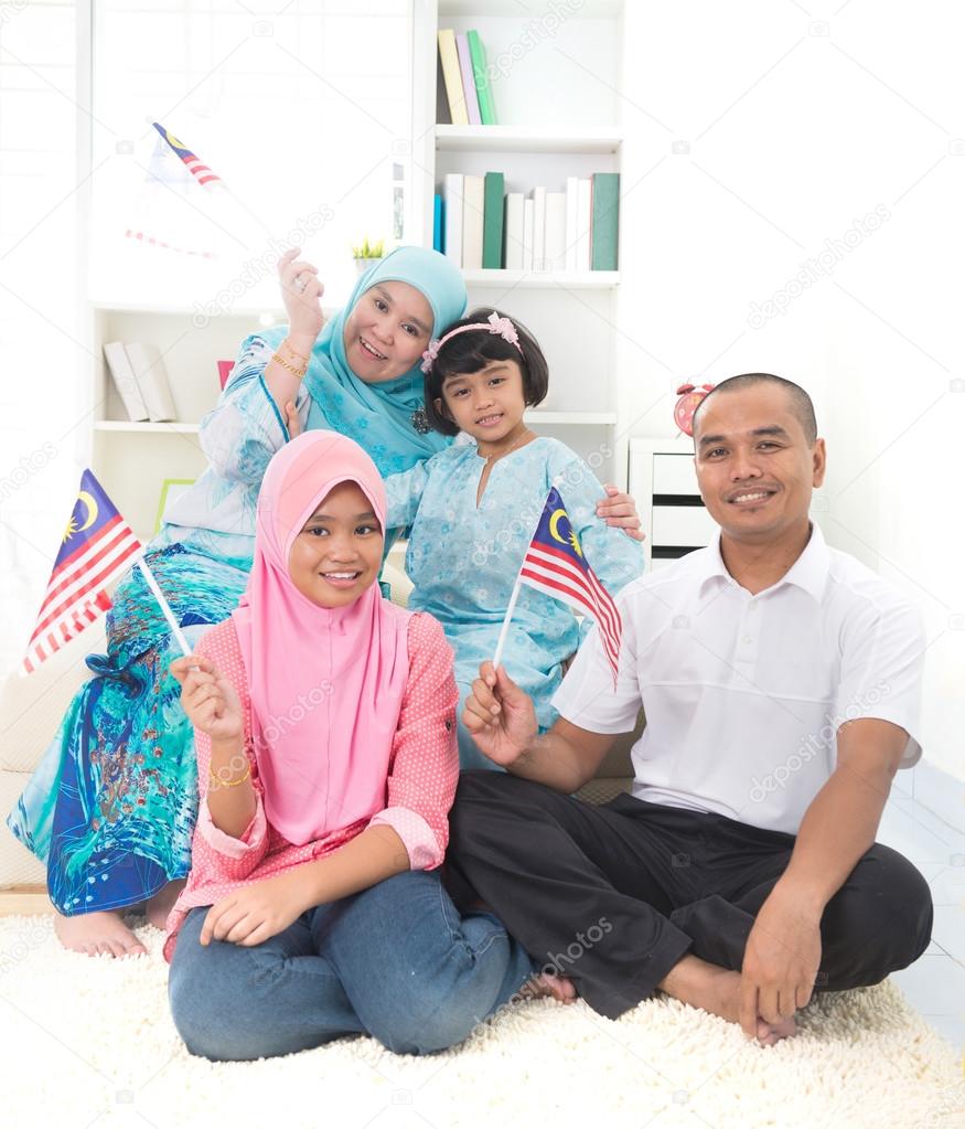 malay family with malaysian flag lifestyle photo