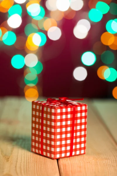 Christmas decorations and presents with background lights — Stock Photo, Image