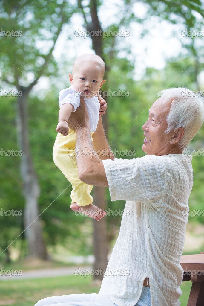 Grandfather having fun with  son