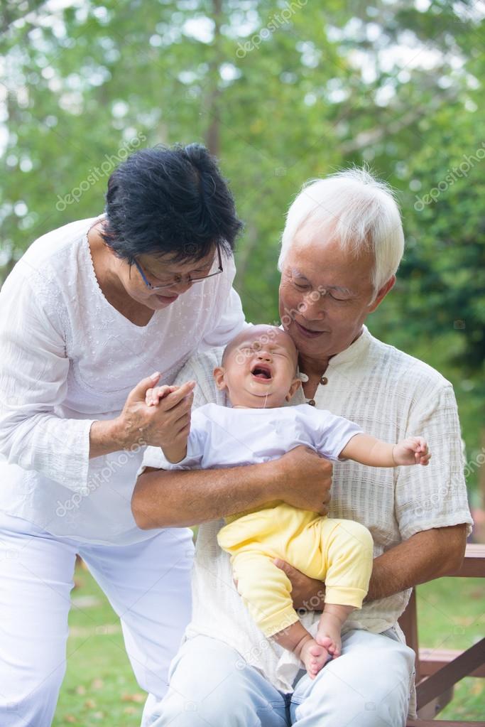Asian baby with grandparents
