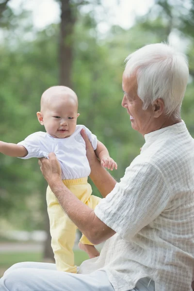 Grandfather having fun with his grandson — Stock Photo, Image