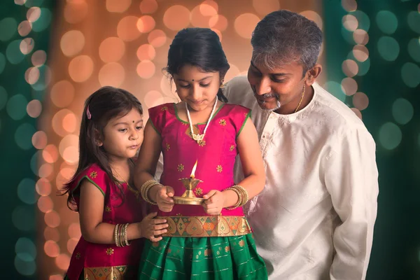 Fagther and daughters celebrating diwali — Stock Photo, Image