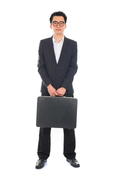 Asian businessman with a suitcase — Stock fotografie