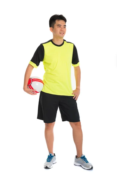 Asian man playing soccer — Stock Photo, Image