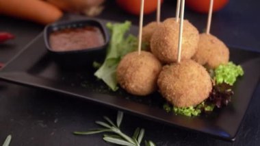 close up footage of curry fish balls with background