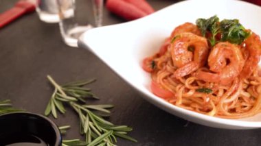 close up footage of pasta with shrimps, tomato sauce and vegetables