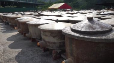 Vats of fish sauce fermenting in the sun