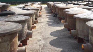 Vats of fish sauce fermenting in the sun