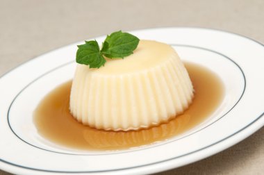 Vanilla and caramel pudding or flan clipart