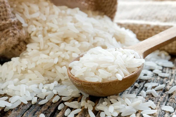 Rice on wooden spoon — Stock Photo, Image